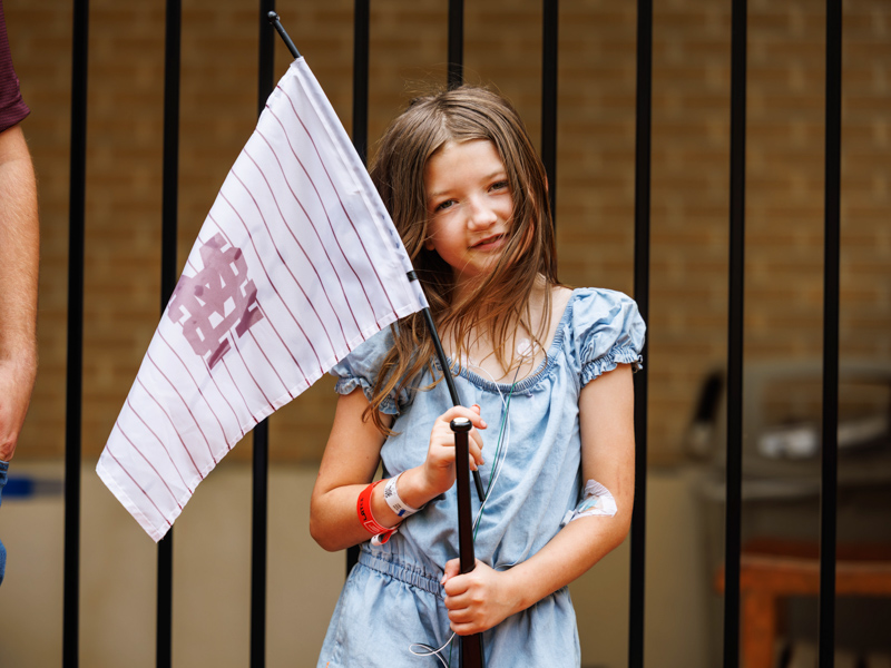 Adalyn Carter, 9, of Lumberton shows off MSU baseball merch gifted to her by the team.