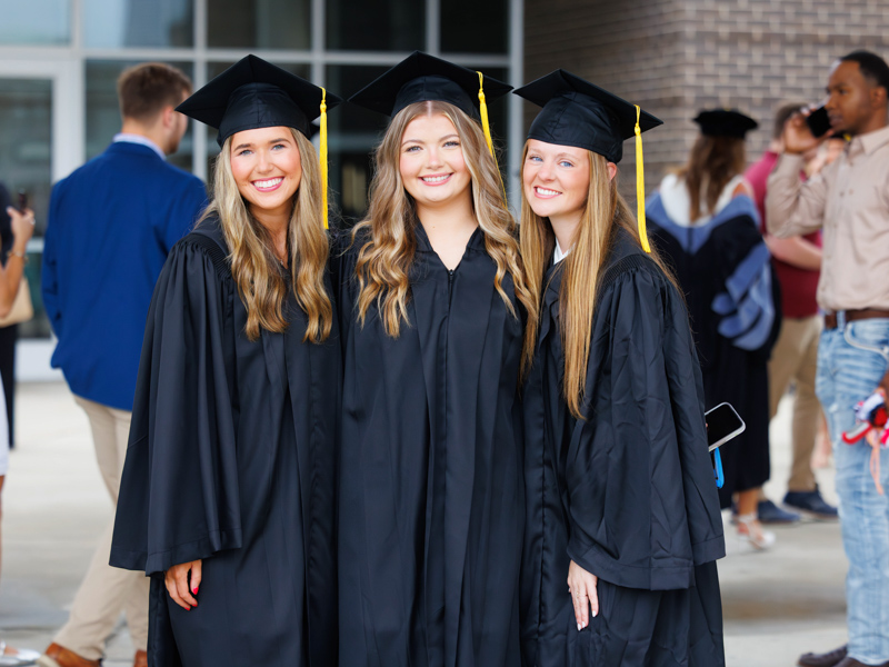 Radiologic sciences BS graduates Brooke Barron, left, Kadence Banaka and Anna Grace McAlpin are all smiles during graduation.