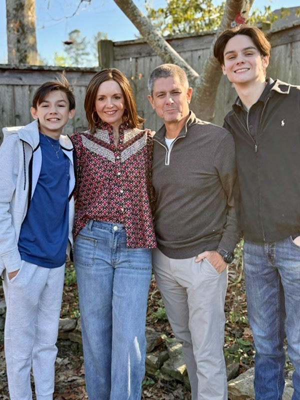 Alice Chaney Herndon smiles with husband Drew and sons Anderson, left, and Parker.