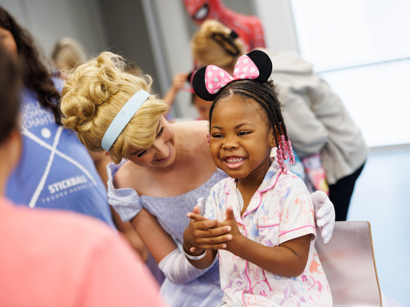 Tzuri Elmore, 5, of Greenville meets Cinderella at Disney Day hosted in the Sanderson Tower Community Room.