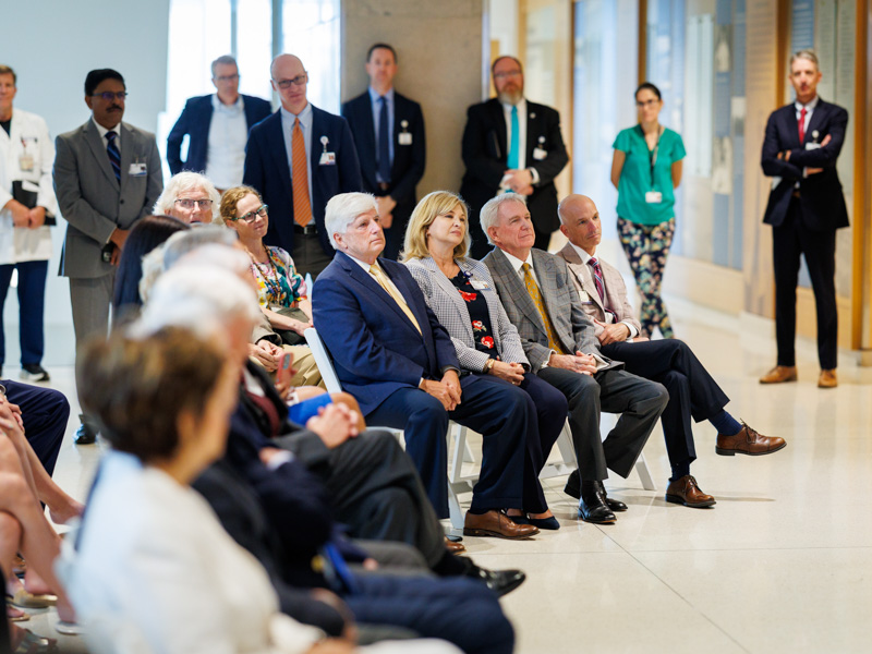Dr. LouAnn Woodward and other university leaders and guests listen attentively to reflections on Dr. Hall's remarkable career. Joe Ellis/ UMMC Communications