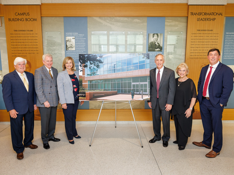 Celebrating the naming of the John E. Hall Research Building are, from left, Dr. Joey Granger, Dr. Dan Jones, Dr. LouAnn Woodward, Dr. John E. Hall and his wife, Becky Hall, and their son, Dr. Michael Hall. Joe Ellis/ UMMC Communications