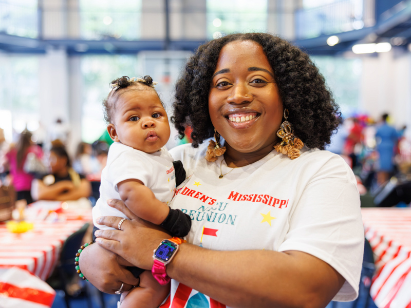 Five-month-old Haidynn Ricks and her mother, Sherry Ricks, are all smiles during the NICU reunion at the children's hospital.