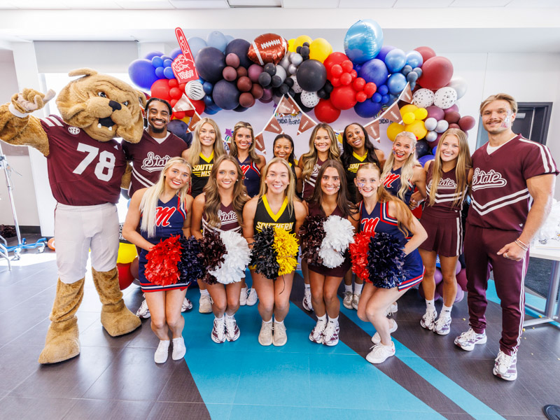 Cheerleaders from Mississippi State University, University of Mississippi and University of Southern University, along with Bully Bulldog gathered in the Sanderson Tower Community Room to bring school spirit to the children's hospital.
