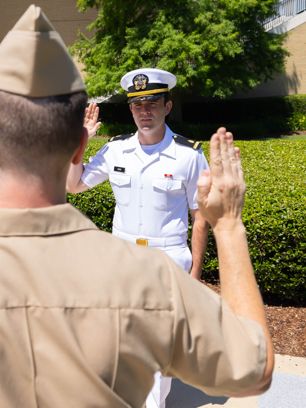 School of Medicine fourth-year student Joseph “JoJo” Dodd is commissioned into the U.S. Navy by Lt. Commander Adrian Evans in 2022. Since graduating from UMMC, Dodd has completed military medical training and cared for patients in locations including San Diego, Hawaii and the Philippines while pursuing emergency medicine residency training.