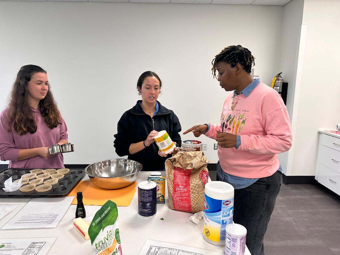 As part of the Value-Based Medical Student Education Training Program, culinary medicine students Katie Rose O’Quinn, left, and Madeleine Brignac, center, participate in a class with registered dietitian Qula Madkin.