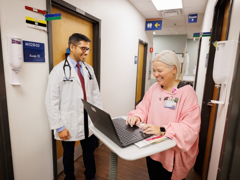 Teamwork is part of the daily routine for Dr. Joydeep Chakraborty, left, associate professor, and Sam Book, RN-transplant coordinator, at UMMC’s Transplant Clinic.