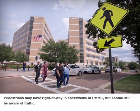 Pedestrians walk crosswalks. 
