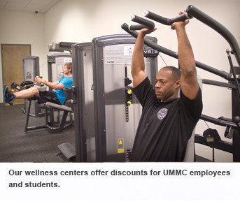 Patients work out on machines in wellness center. 