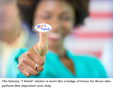 Woman holds "I voted sticker."