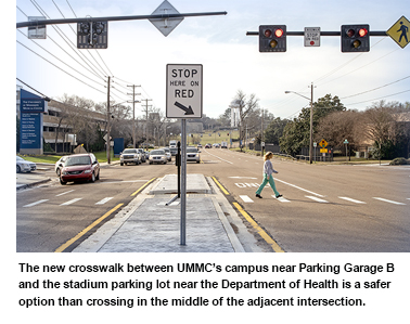 The new crosswalk between UMMC’s campus near Parking Garage B and the stadium parking lot near the Department of Health is a safer option than crossing in the middle of the adjacent intersection.