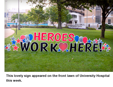 A sign that reads "Heroes Work Here!" in the front entrance fo UMMC Adult Hospital that encouraged workers during Coronavirus Pandemic.