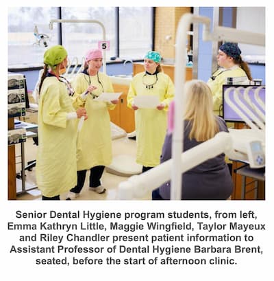 Senior Dental Hygiene program students, from left, Emma Kathryn Little, Maggie Wingfield, Taylor Mayeux and Riley Chandler present patient information to Assistant Professor of Dental Hygiene Barbara Brent, seated, before the start of afternoon clinic.