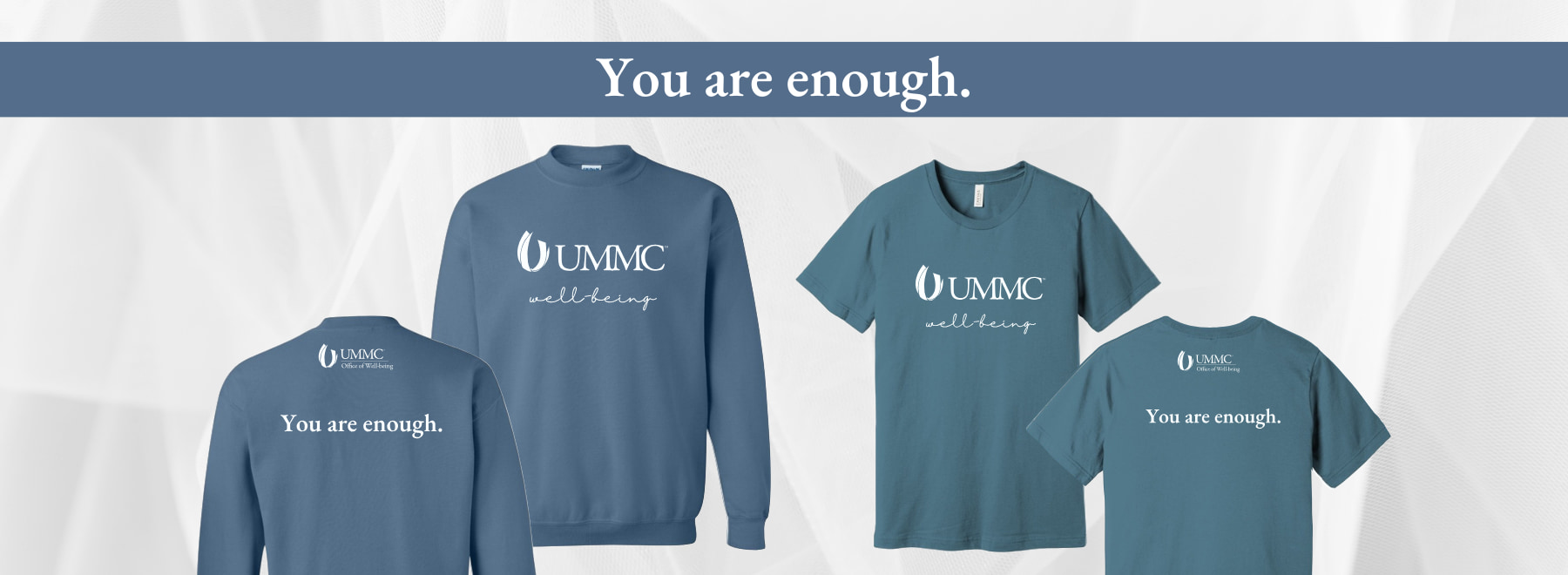 Collection of blue ummc wellness apparel with motivational slogan 