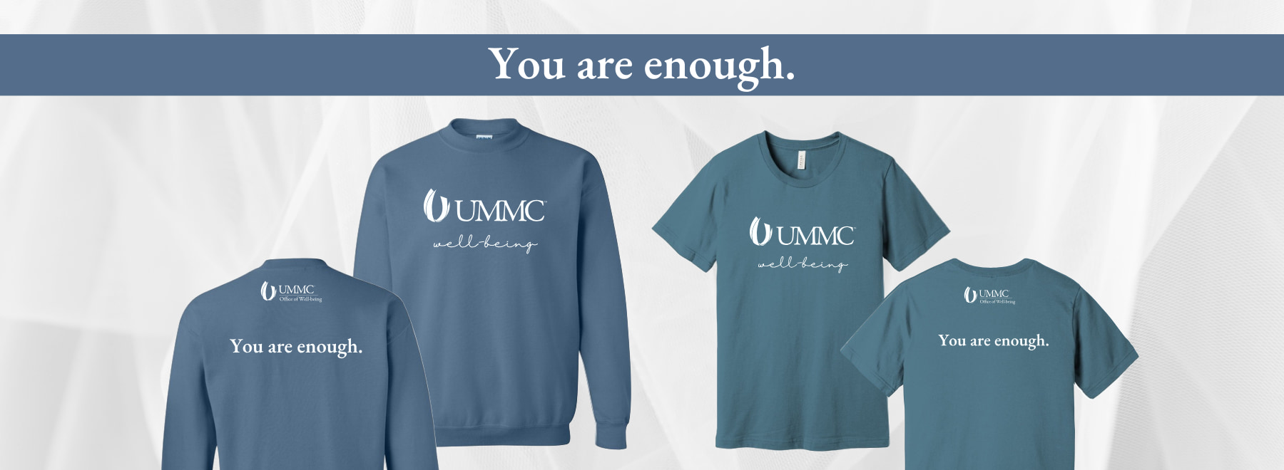 Collection of blue ummc wellness apparel with motivational slogan "you are enough."