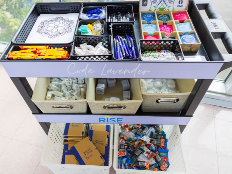 The Office of Well-being has created a Code Lavender cart supplied with chocolate and other goodies that can be transported to floors or departments where employees need a pick-me-up.