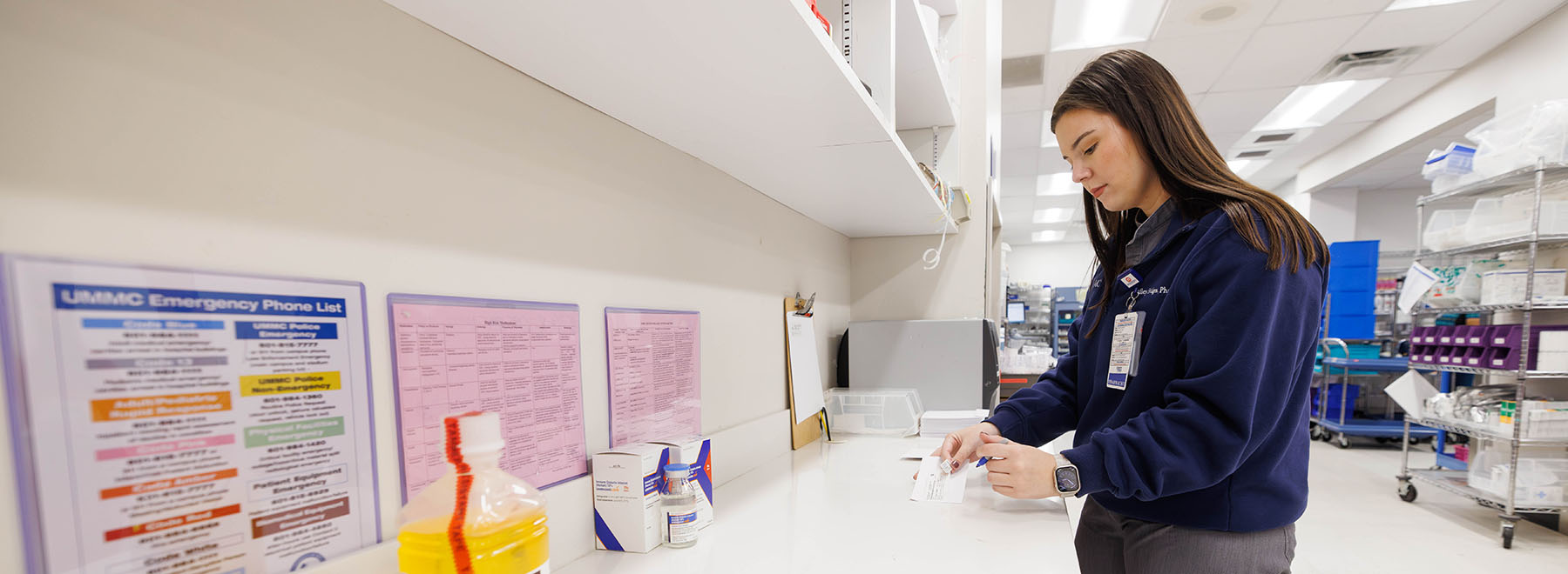 Female UMMC-based pharmacy resident at work.