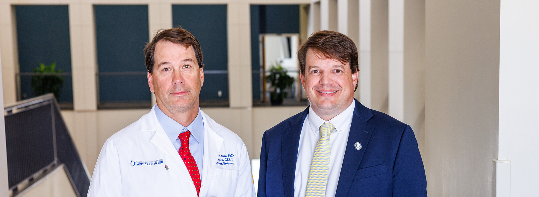 Dr. David Stec with Dr. Gene Bidwell inside the Nelson Student Union.