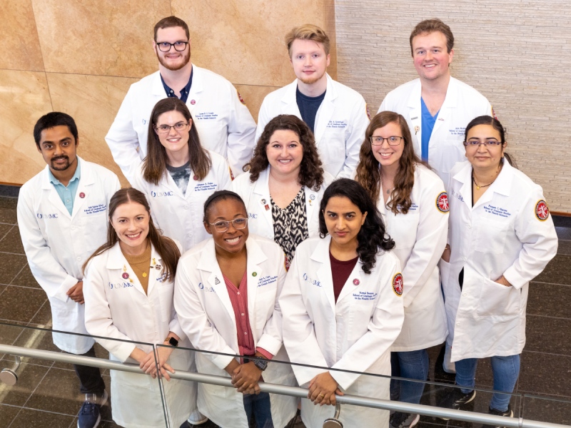 Indoor group shot of 11 PhD students inside the Translational Research Center.