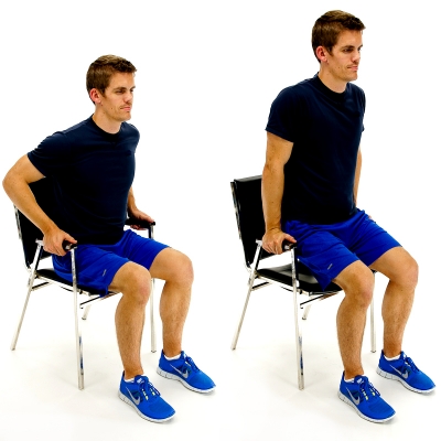 Man performing dips in chair exercise.