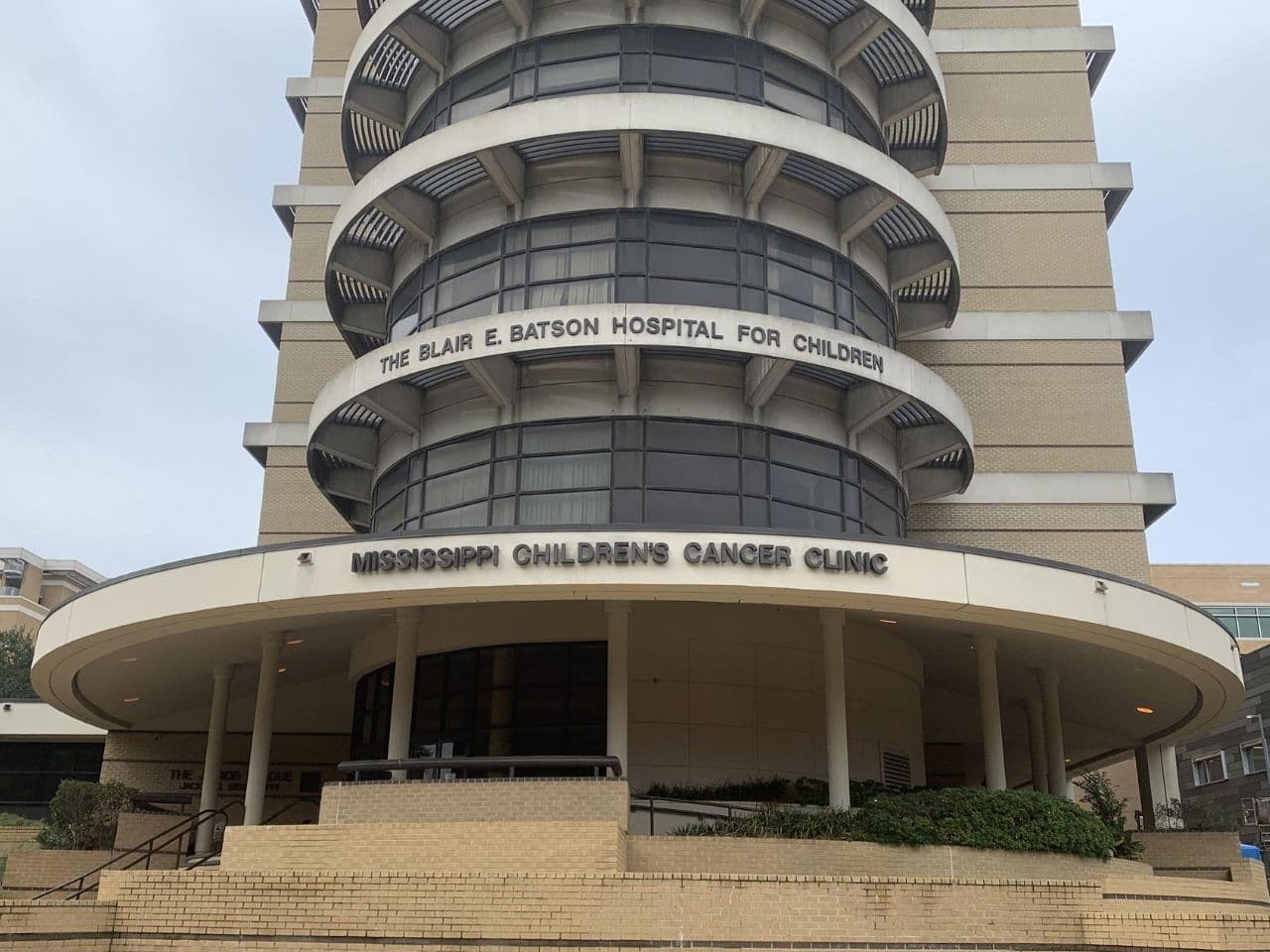 Outdoor shot of the clinic entry featuring several stories.