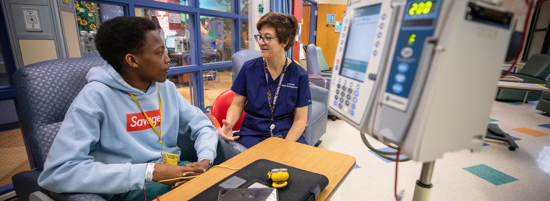 Children's of Mississippi hematologist Dr. Melissa McNaull talks with patient Tyler Jackson of Ridgeland at the Center for Cancer and Blood Disorders.