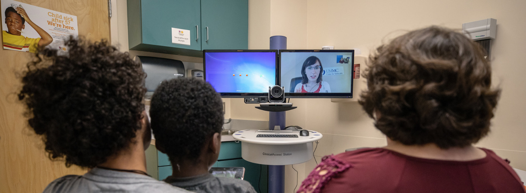 Two children and their mother visit a telehealth provider.