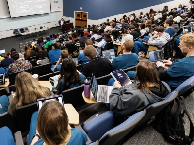 A full house of students attend a lecture in the lower amphitheater.
