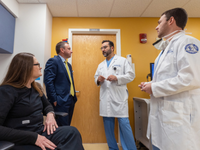 Team members at the Morris Center discuss a patient case.