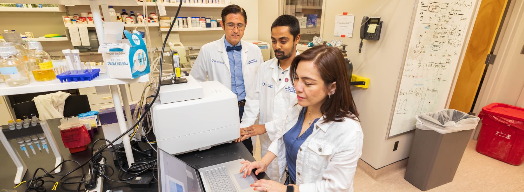 Group photo of Molecular Center of Health and Disease team members in lab.