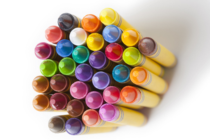 Crayons grouped together over white background.
