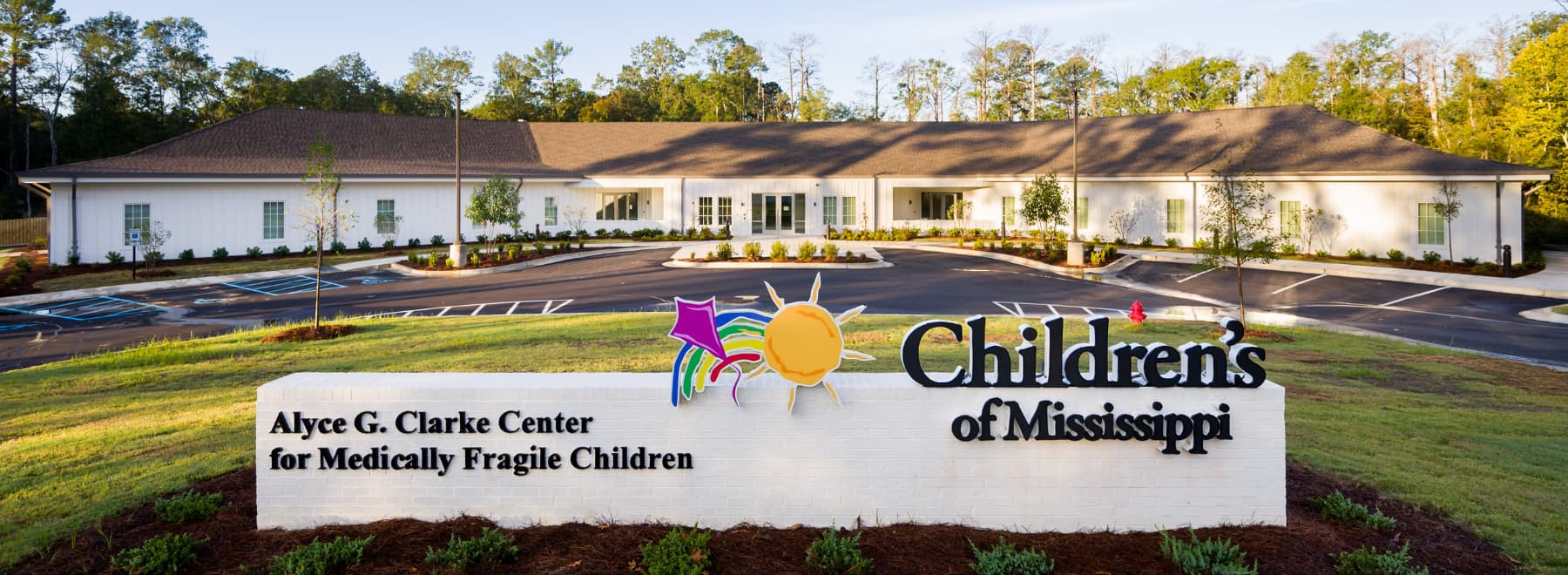 The Clarke Center in the background with its Children's of Mississippi sign in the foreground..