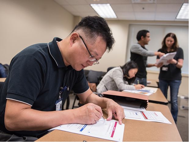 Biostatistics student and faculty in classroom