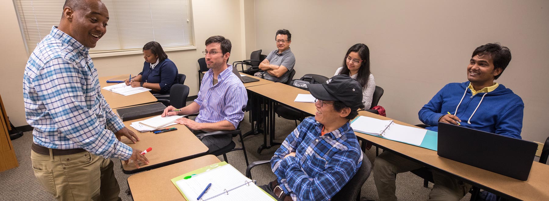 A faculty member leads a class of students