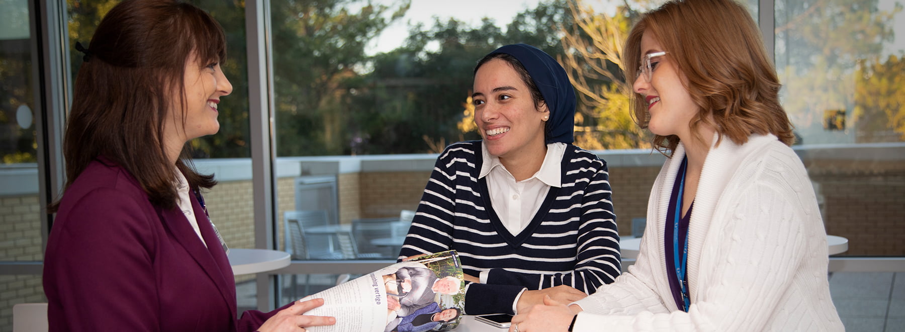 Three women in discussion