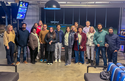 SOPH students, faculty, and deans at Topgolf