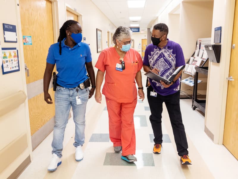 Ofc. Mays (l) and Sgt. Hiley (r) meet with clinical staff during a BRT follow-up.
