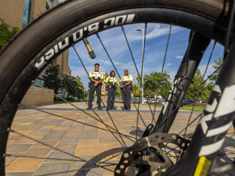 Police officers behind the wheel of a bicycle