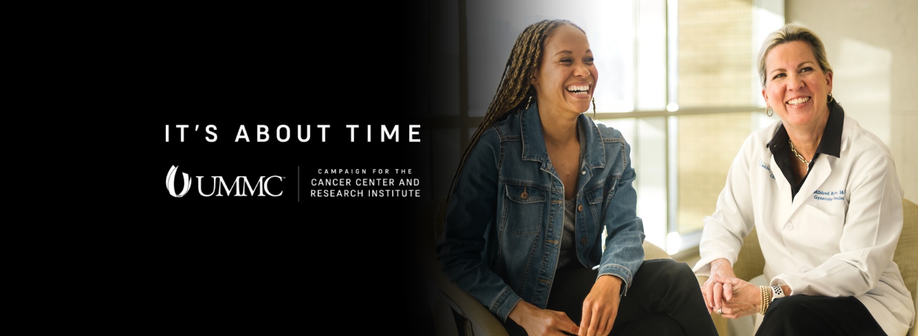 Patient and provider laughing together.