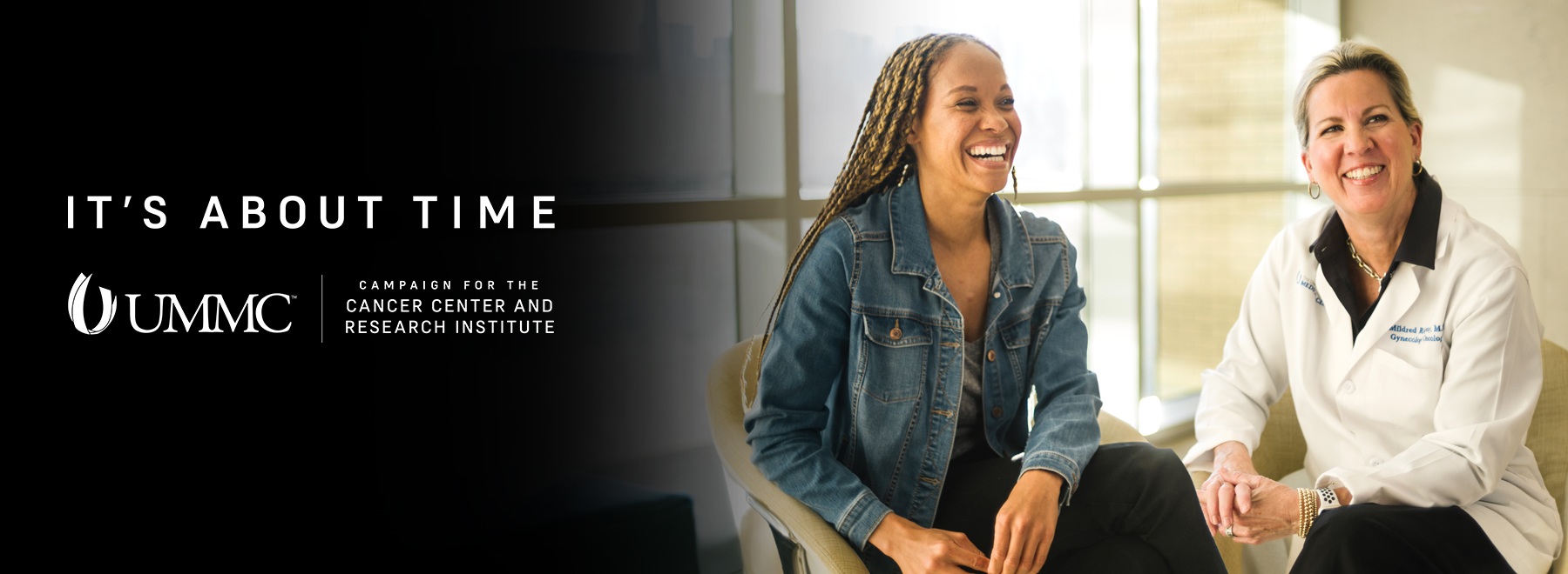 Patient and provider laughing together.