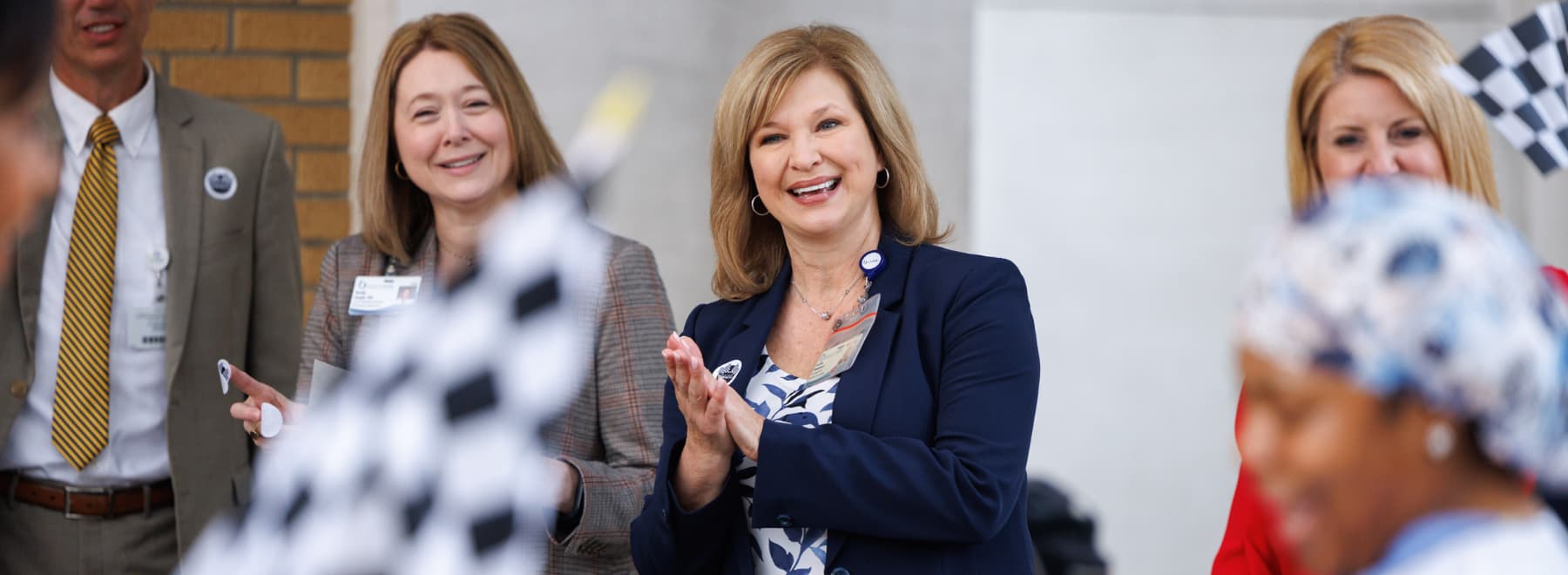 Assistant Vice Chancellor for Academic Affairs Dr. Natalie Gaughf and Vice Chancellor for Health Affairs Dr. LouAnn Woodward greet UMMC employees arriving at the Adult Hospital to kick off Patient Safety Week.