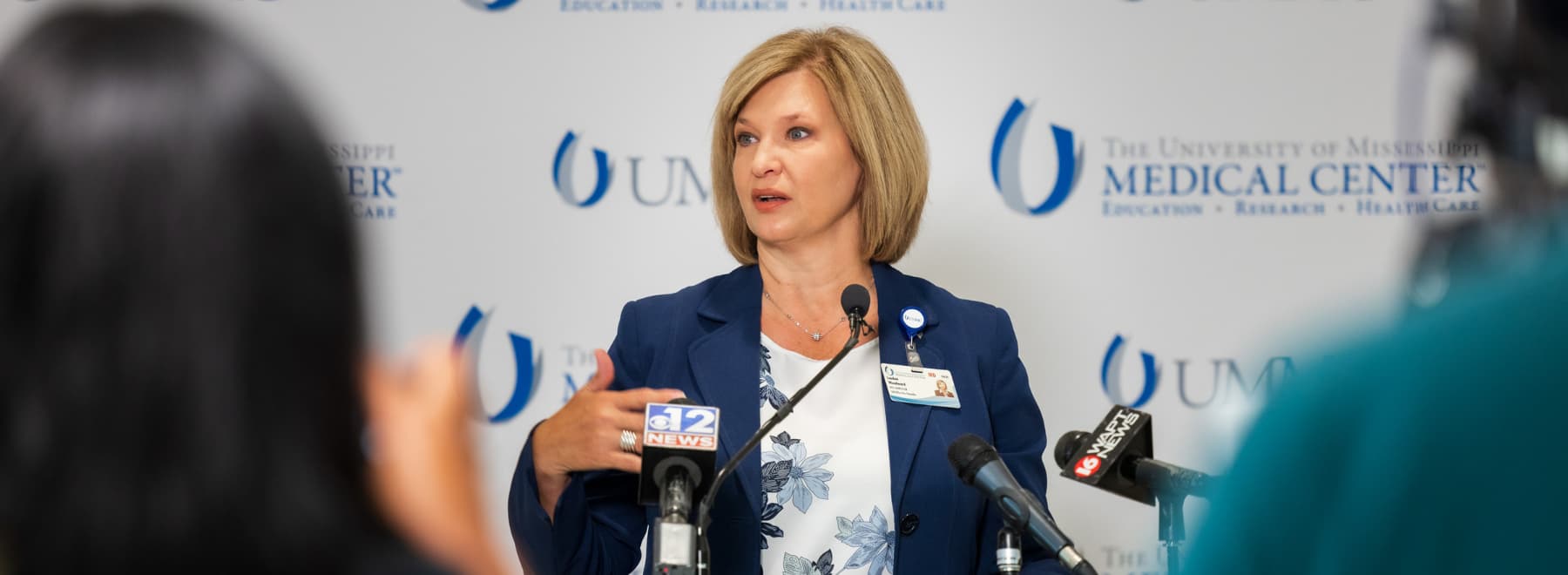 Dr. LouAnn Woodward, vice chancellor for health affairs and dean of the School of Medicine, speaks during a press conference.