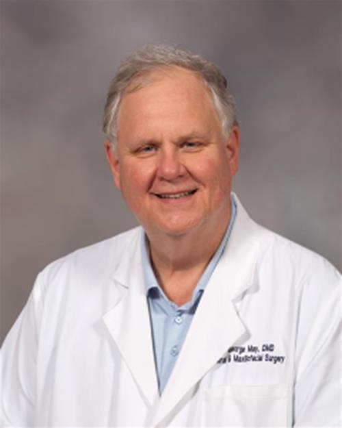 George W. May Jr., DMD