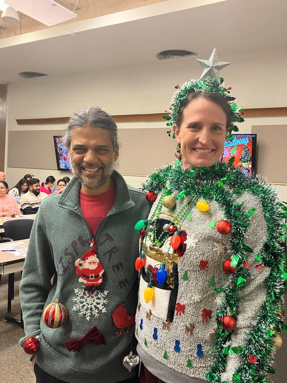 Dr. Channabasavaiah Gurumurthy and research scientist Jackie Starrett were finalists in the holiday sweater competition.