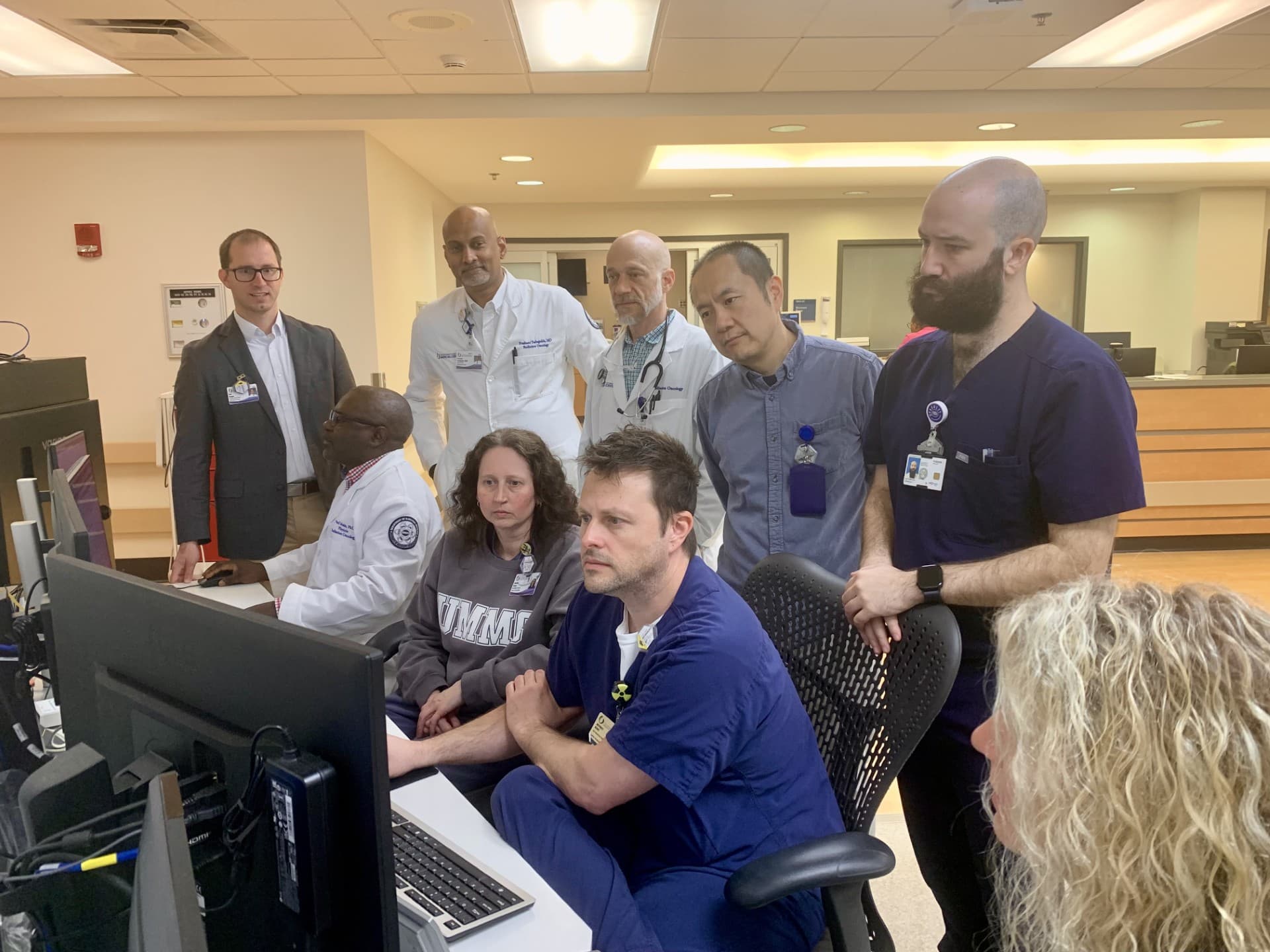 Faculty and care team members watch the first Ethos treatment in Radiation Oncology.