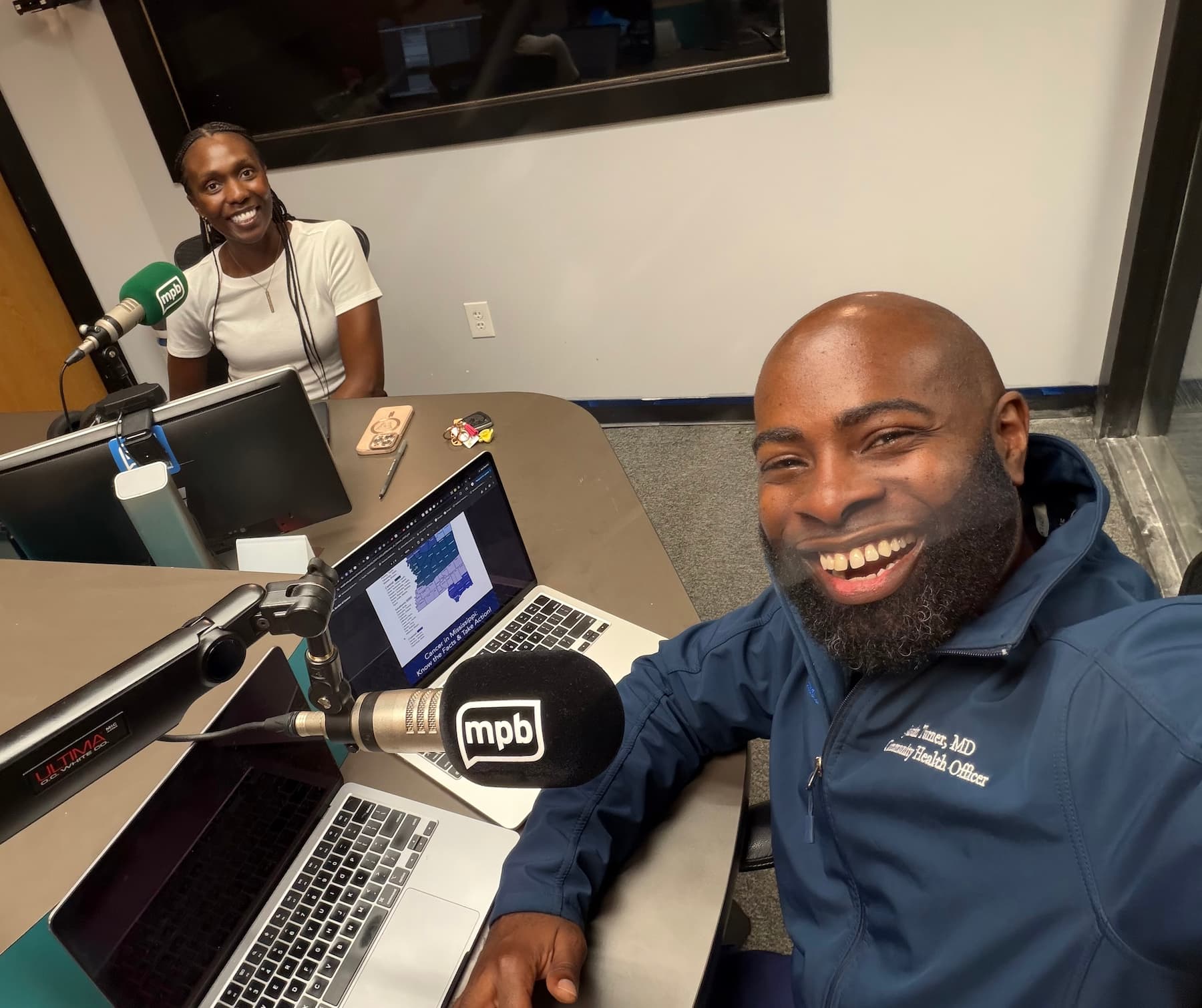 Dr. Justin Turner smiles with Dr. Jasmine Kency before a Southern Remedy interview at Mississippi Public Broadcasting.