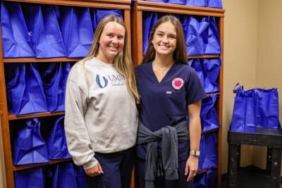 UMMC School of Nursing students Parks Chandler and Caroline Ladner working at the EversCare Clinic as part of their Population-Based Nursing coursework