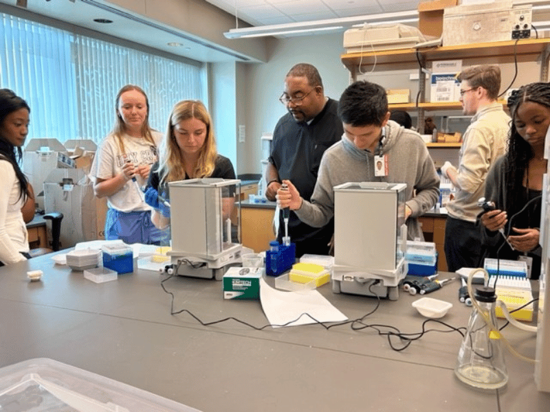 SURE students in lab doing hands-on activities