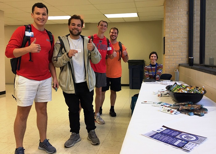 Four students enjoy candy treats