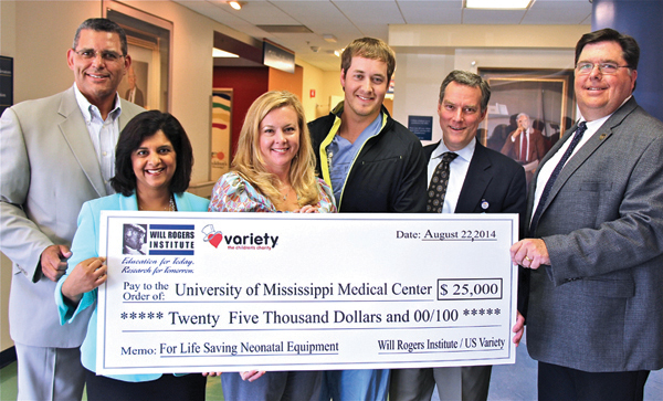 Todd Vradenburg, left, and Ron Krueger II, right, present a $25,000 grant to, from left, Dr. Sajani Tipnis, Tara Goddard, clinical director of the Newborn Center and Center for Maternal & Fetal Care, Billy Needham and Dr. Rick Barr.